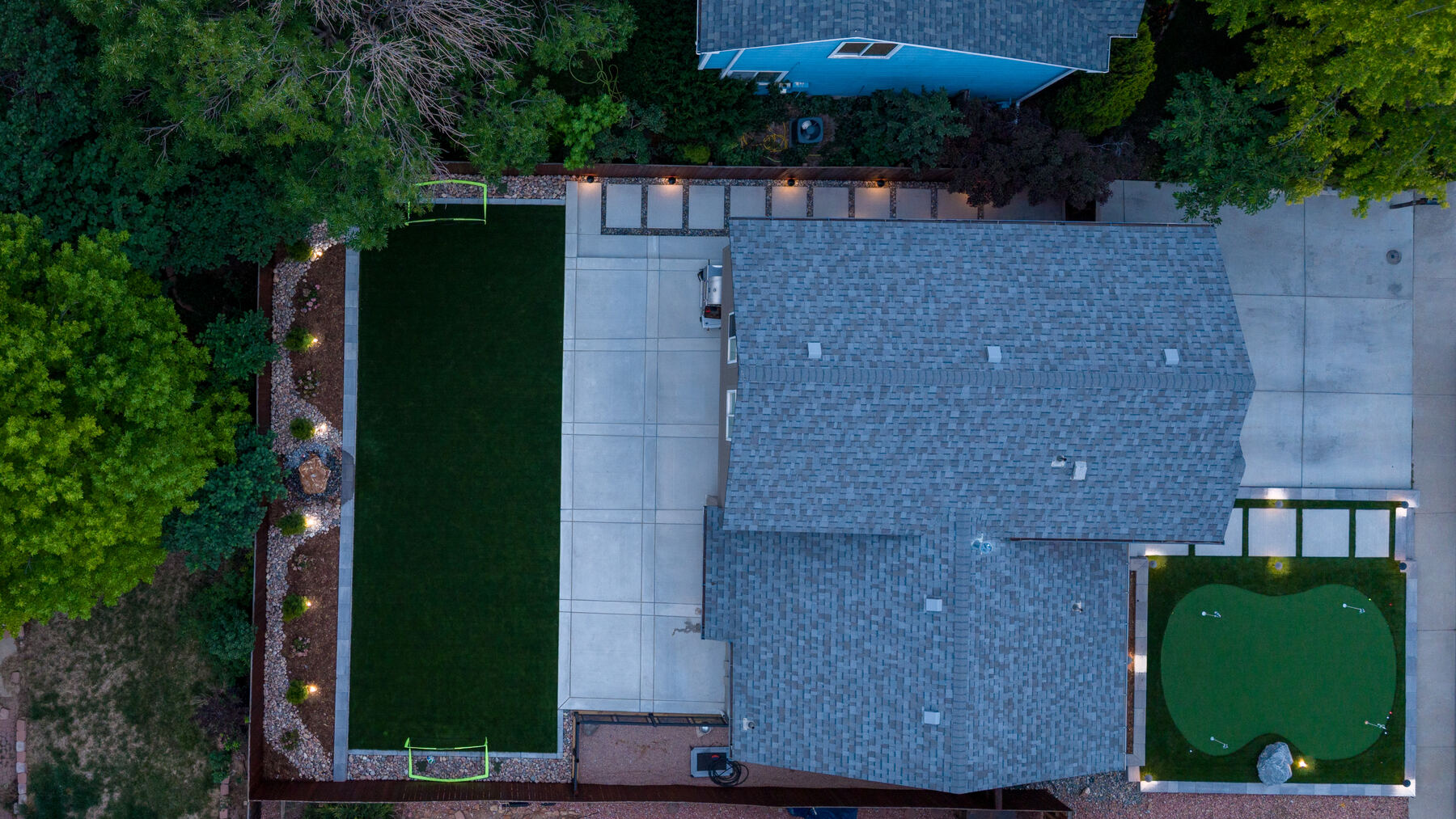 Backyard turf, putting green and patio from above