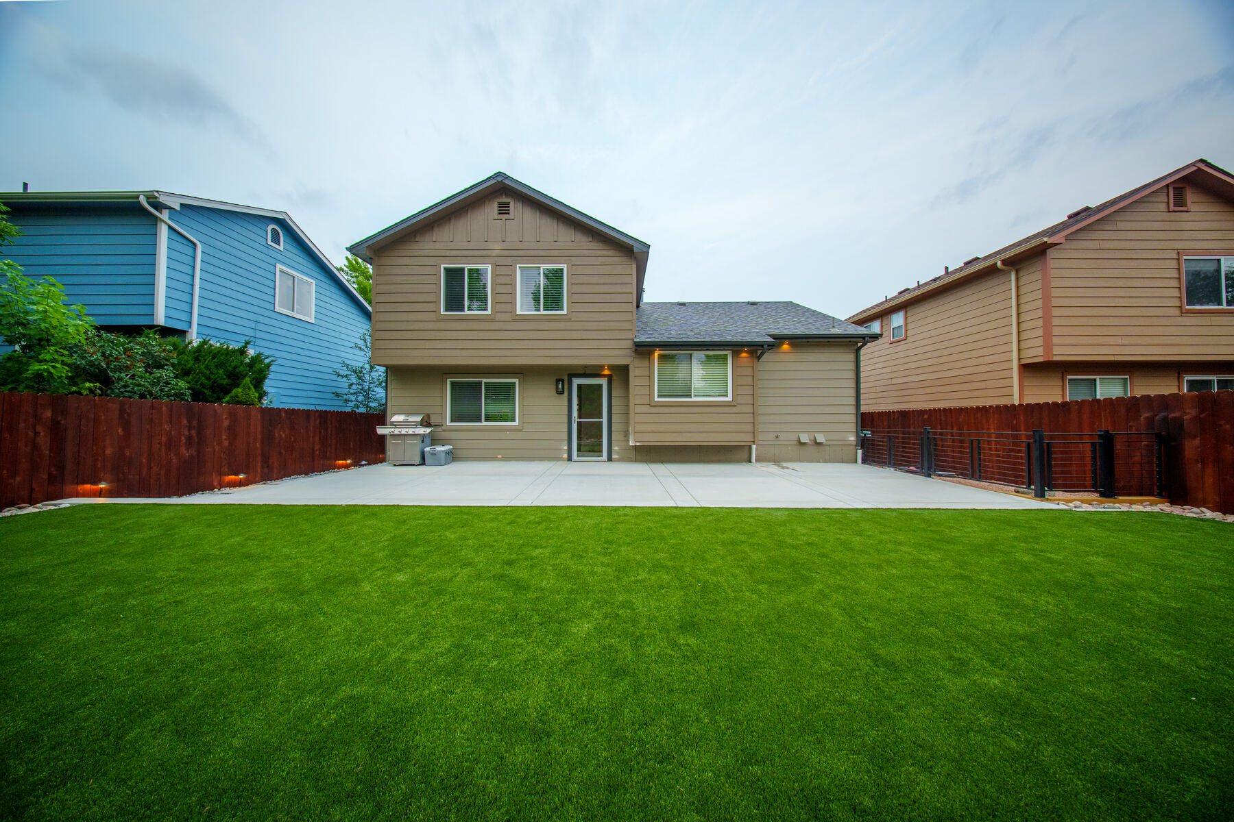 Fresh backyard lawn and landscape