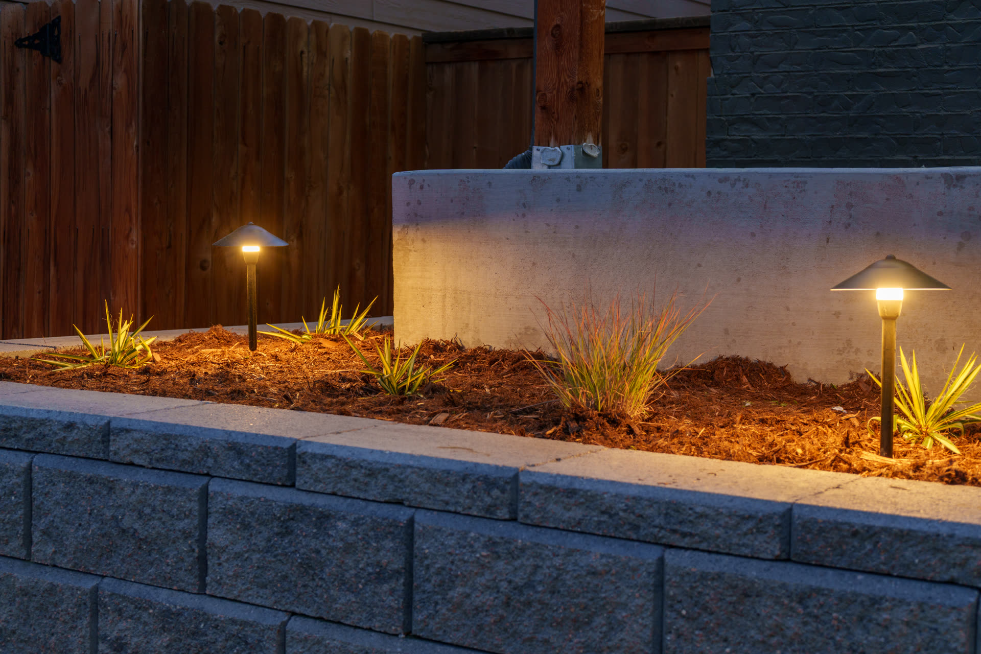 Retaining wall, planting bed and lighting