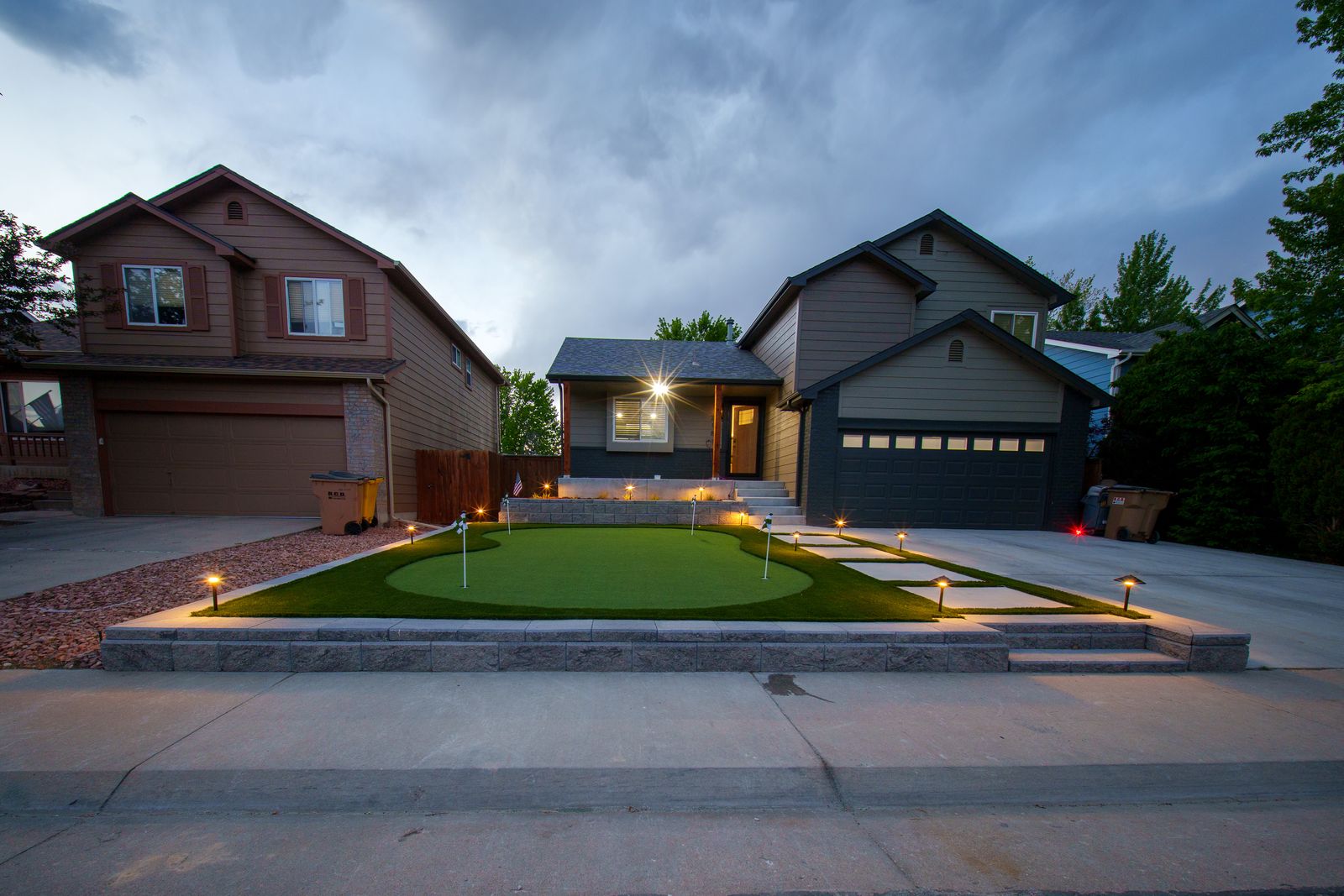Front-yard putting green at dusk